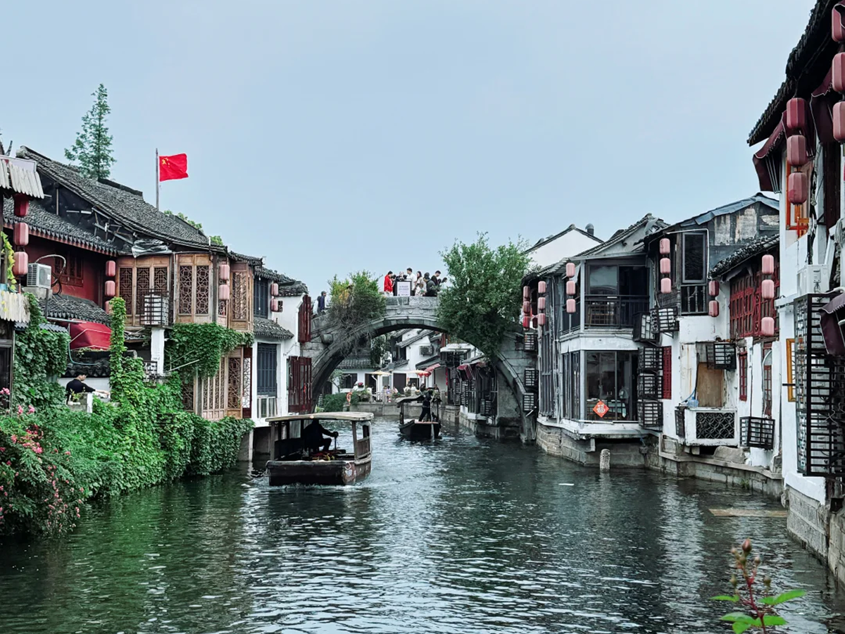 Stone arch bridge and red lanterns in Zhujiajiao ancient town