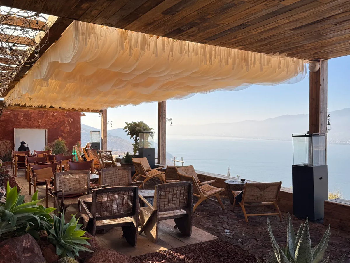 Lakeside terrace cafe with rattan chairs in Dali