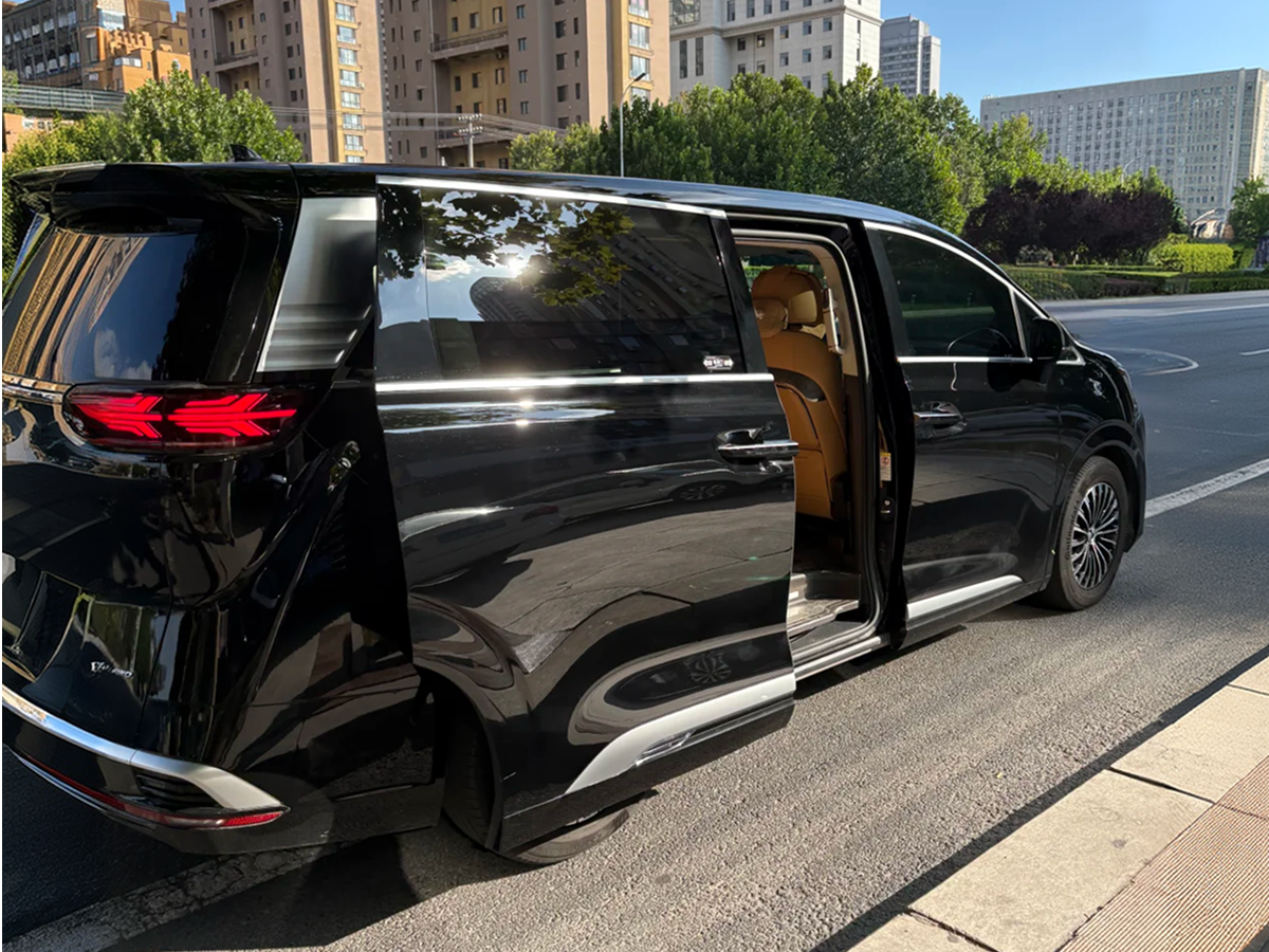 Private transfer van parked on a street