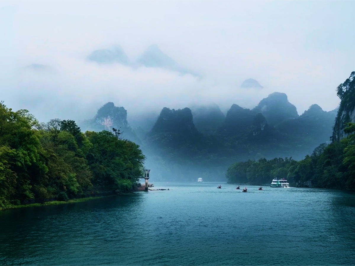 Misty karst hills along the Yulong River near Yangshuo
