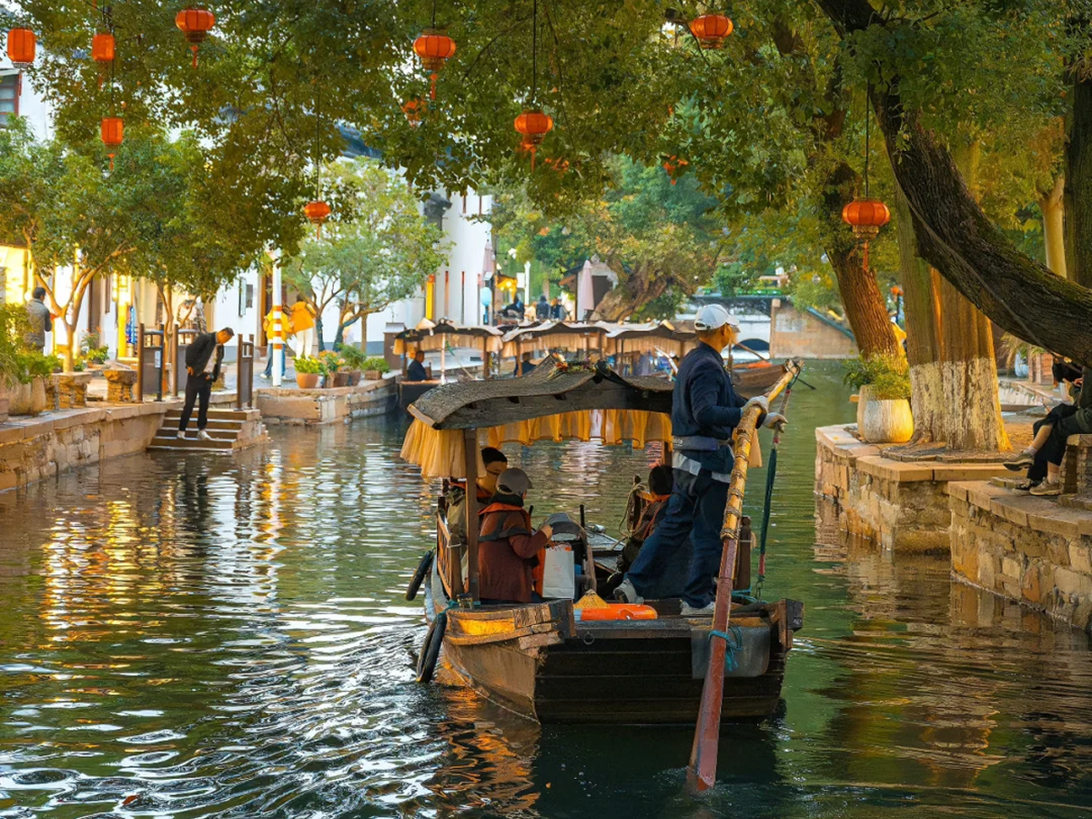 Wooden boat carrying visitors on a Zhujiajiao canal