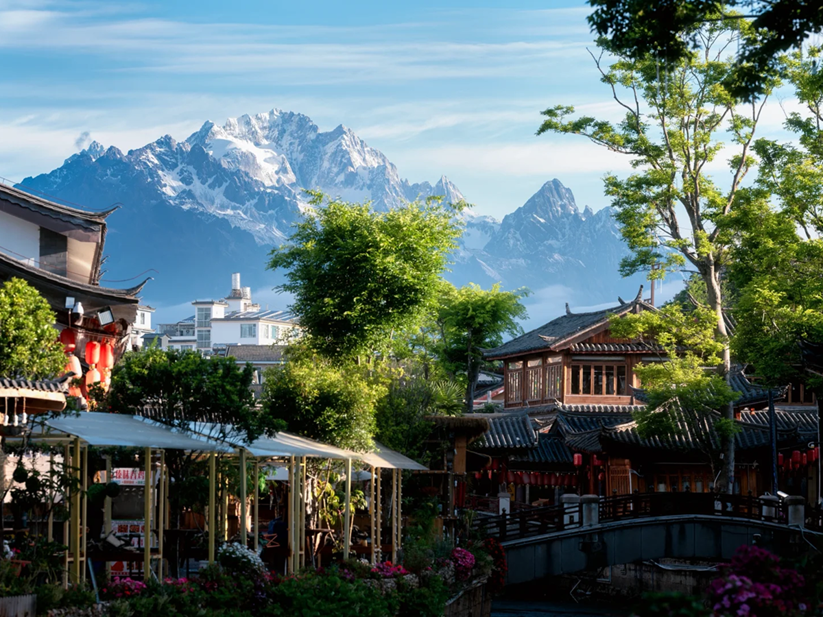 Lijiang Old Town streets with Jade Dragon Snow Mountain in the background