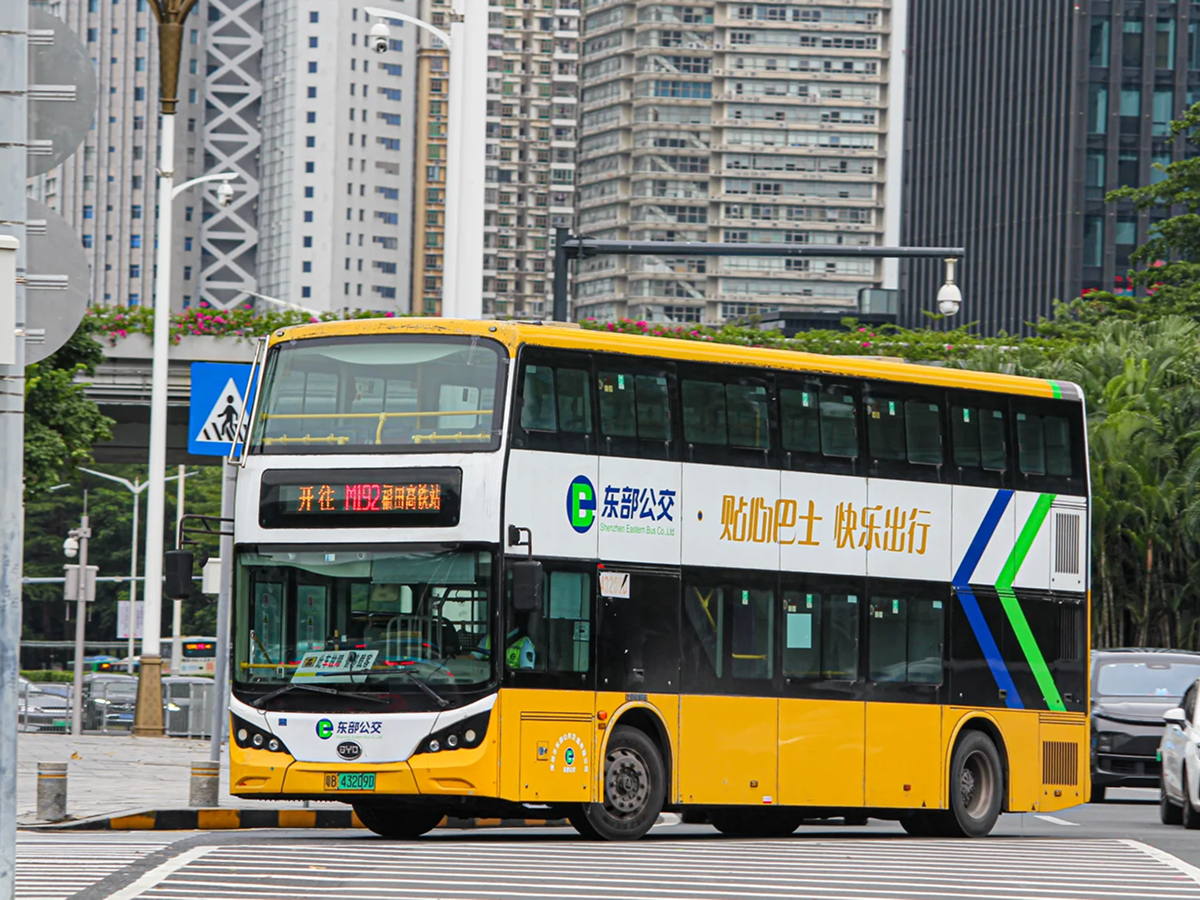 Yellow double decker sightseeing bus on a Shenzhen street