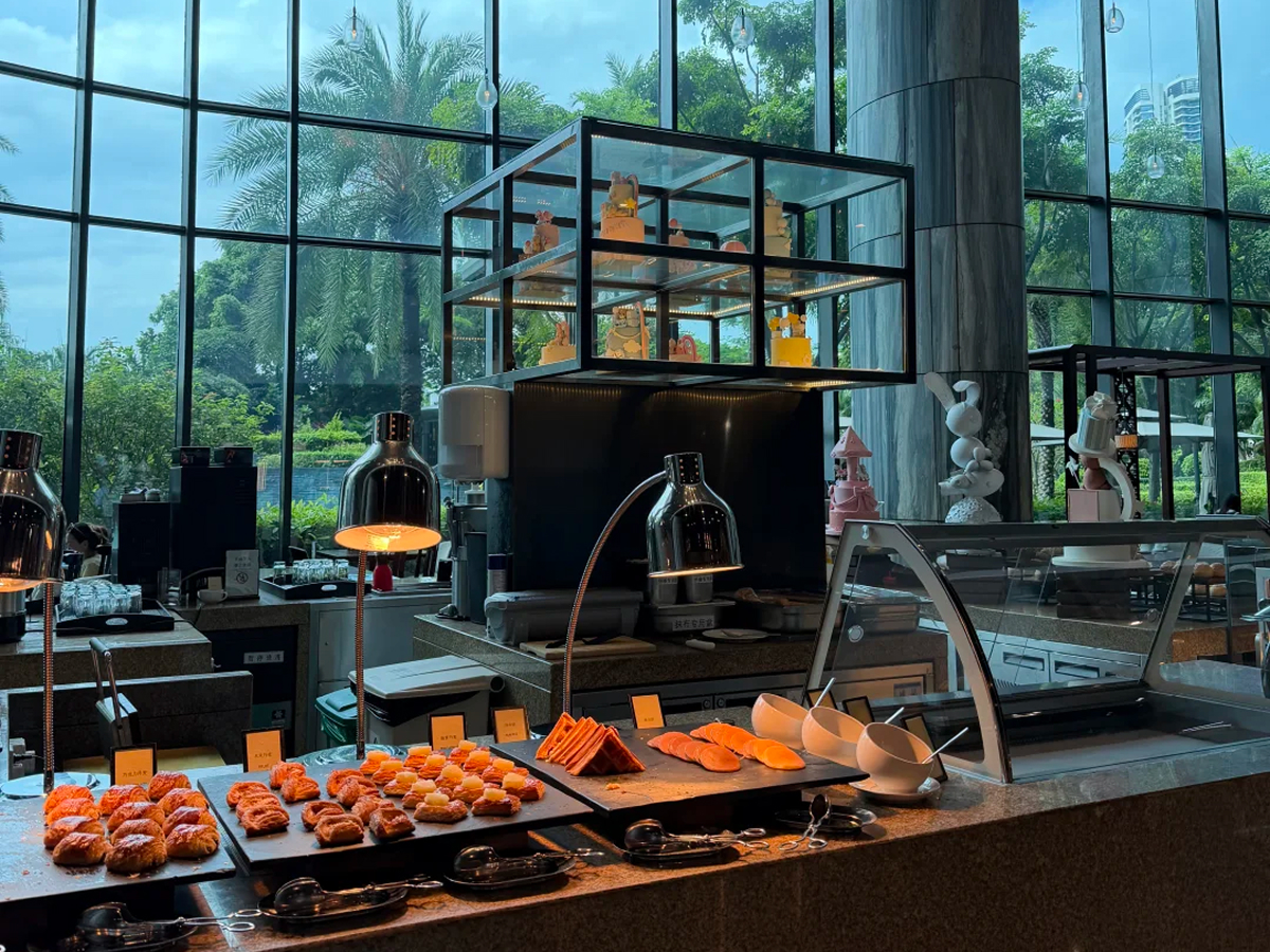 Hotel breakfast buffet with breads and warm dishes