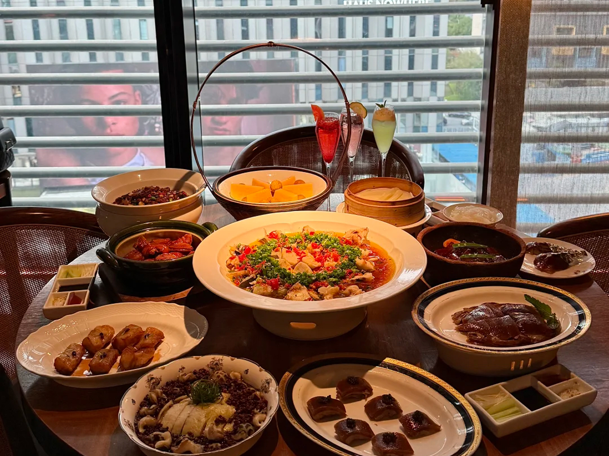 A table of Sichuan dishes in a Chengdu restaurant