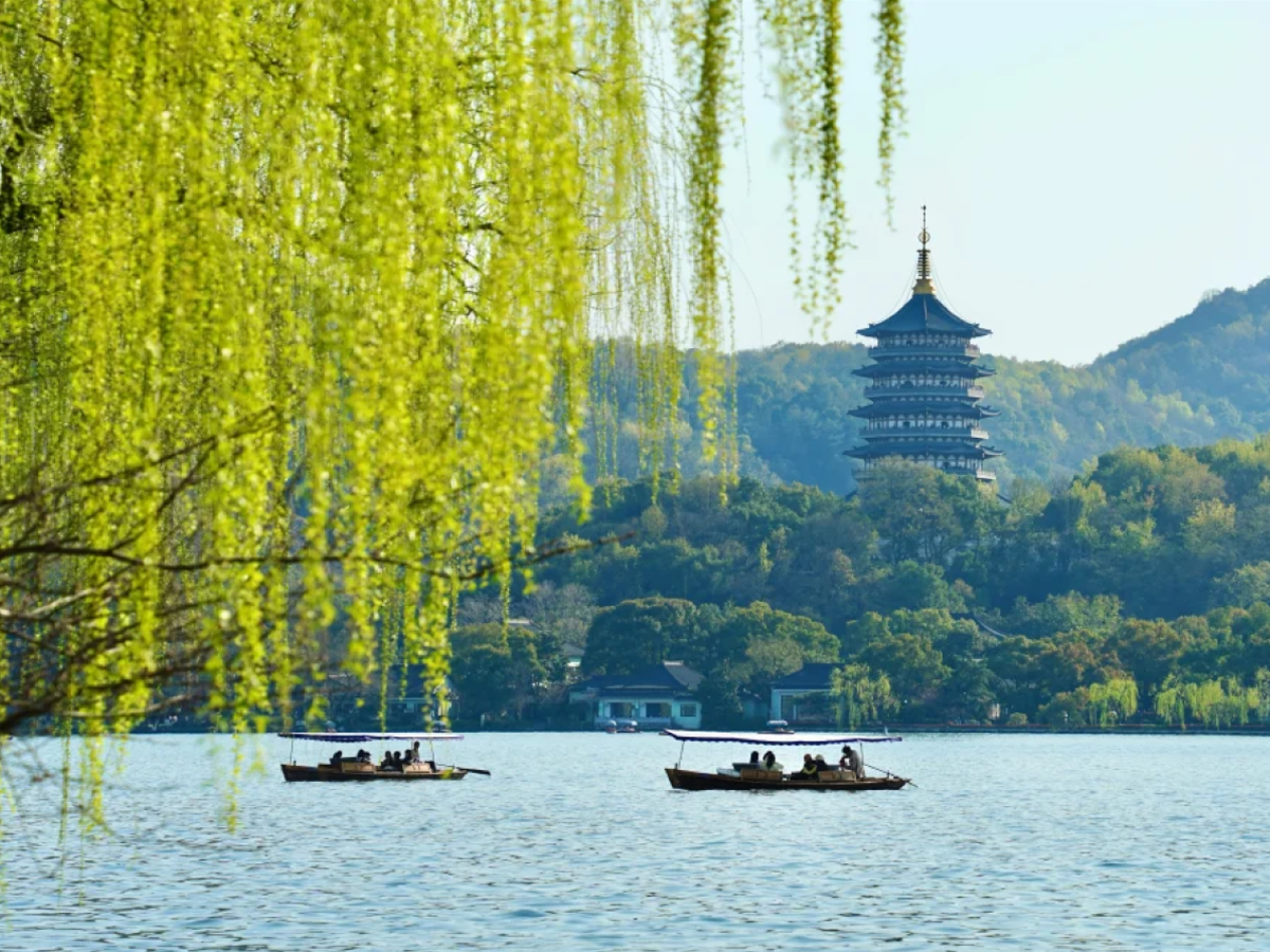 West Lake with willows and Leifeng Pagoda in the distance