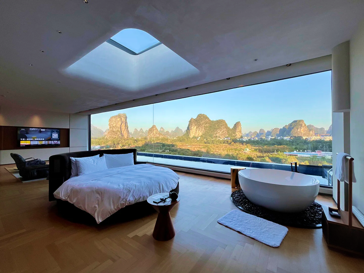 Guilin hotel room with floor-to-ceiling windows overlooking karst peaks