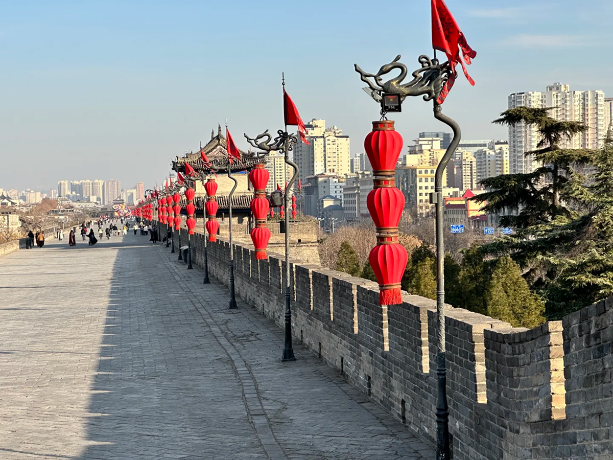 Red lanterns along the brick walkway of Xi'an City Wall