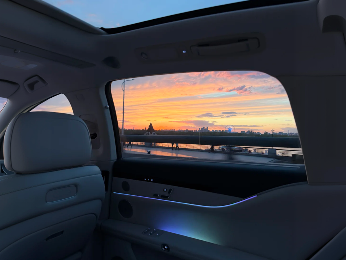 City riverside skyline at dusk seen from a car window