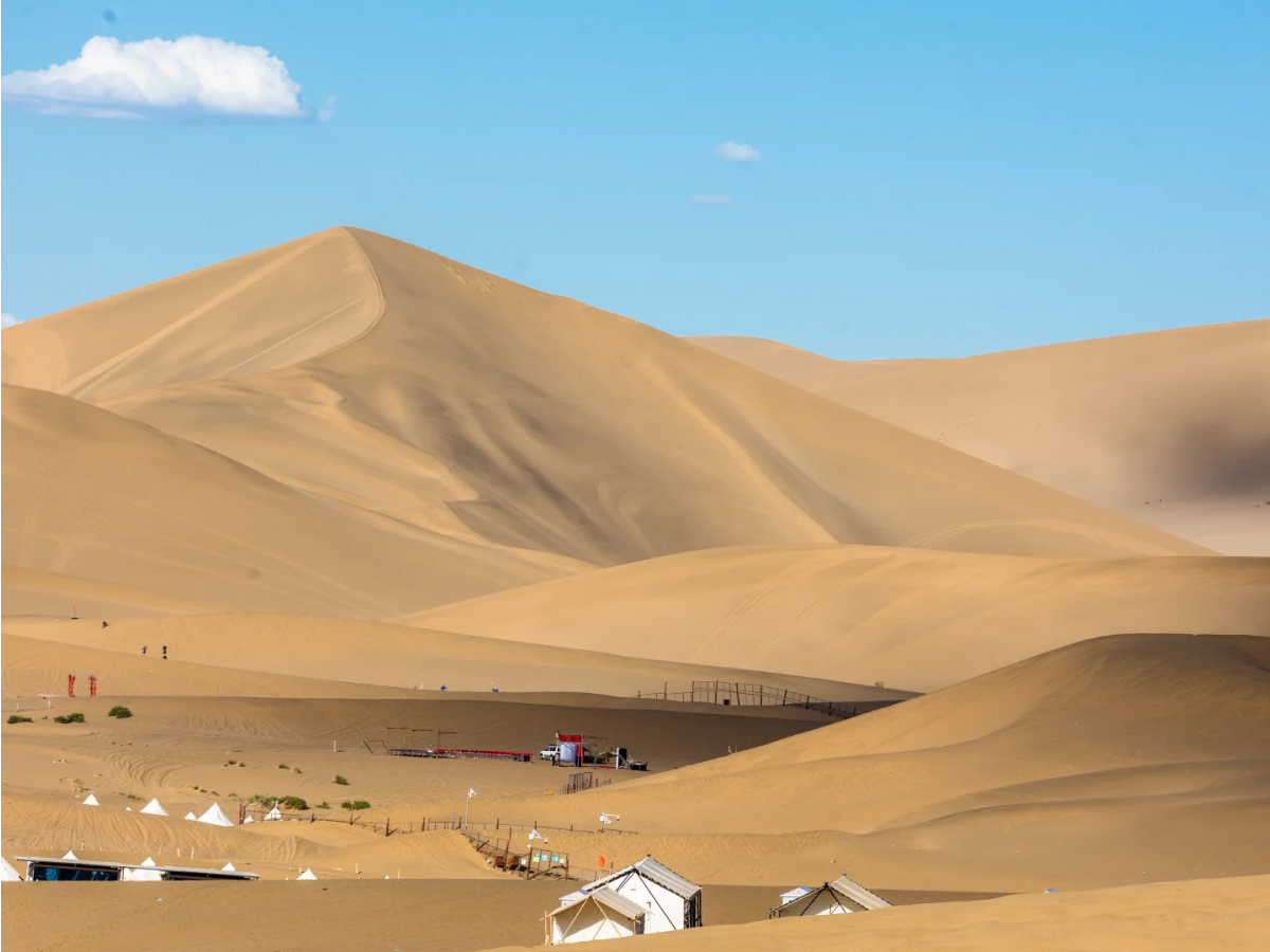 Rolling sand dunes at Mingsha Mountain in Dunhuang