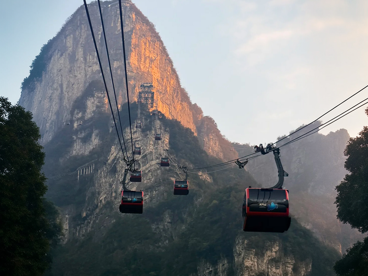 Cable car climbing above peaks in Zhangjiajie
